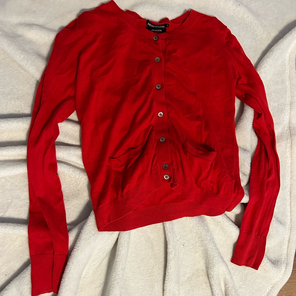 Red button up blouse.